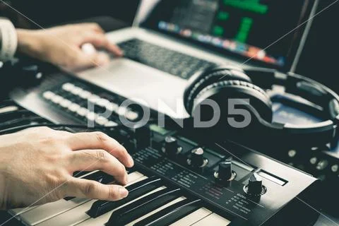 Music producer is recording sound on Computer Stock Photos