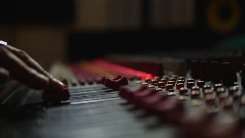 Music producer working in music studio, controlling the sound mixer Stock Footage