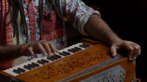 Music production studio. Creative world. Hindi man playing harmonium in the Stock Footage 138950731