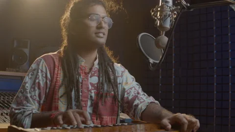 Music production studio. Creative world. Hindi man playing harmonium in the Stock Footage 138950795