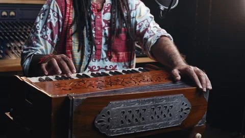 Music production studio. Creative world. Hindi man playing harmonium in the Stock Footage 141462445