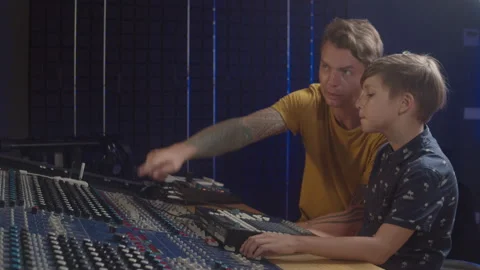 Music production studio. Kid learning about recording methods and the production Stock Footage 138652640