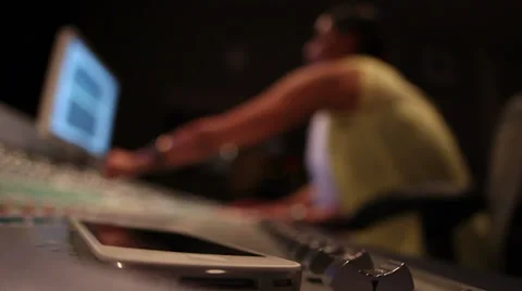 Music Production Studio -  Scene 4 - Man and Women mastering music - Phone ri Stock Footage 34304350