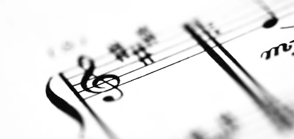 A music score sheet with the focus on the G-clef Stock Photos