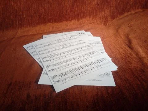 Music sheets on red background Stock Photos