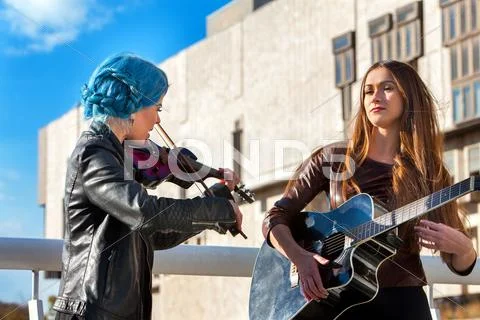 Music Street Performers With Girl Violinist. Autumn Mood.