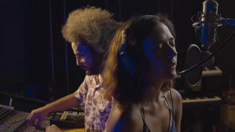 Music studio. Creative people. Hispanic man and woman working in the recording Stock Footage 139143174