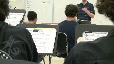 Music teacher instructing class Stock Footage 8979922