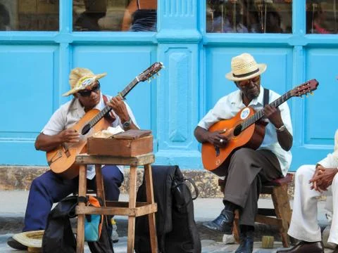 Musical artists playing on old Havana (Cuba). Stock Photos