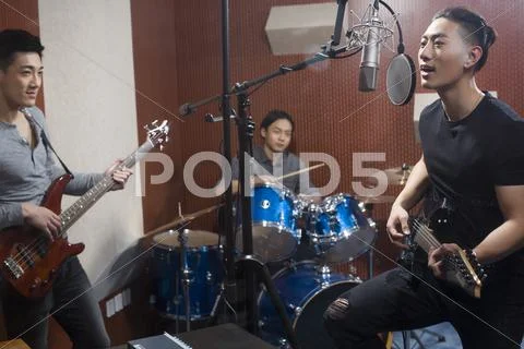 Musical Band In Recording Studio