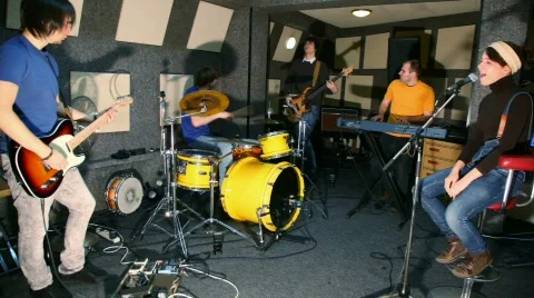 Musical group of five persons playing in recording studio Stock Footage 584264