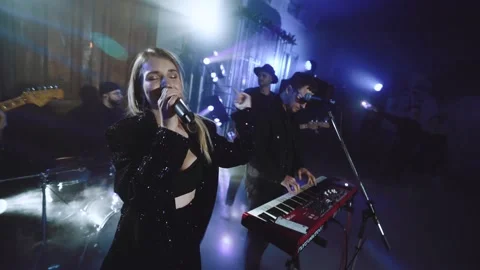 Musical group performs at the wedding during the first dance of the newlyweds Stock Footage 169038649