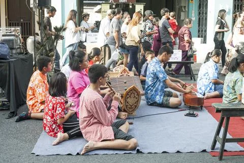 Musical group playing different instruments on city street in Phuket, Thailan Stock Photos
