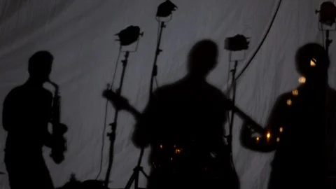 Musical instruments and musicians shadow composition Stock Footage 95392838