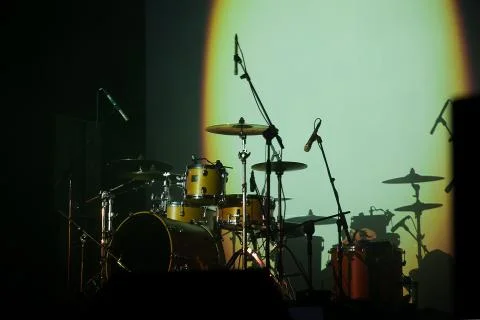 Musical instruments - drum, drums, microphone on an empty stage Stock Photos