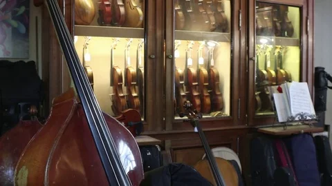 Musical instruments in a luthier shop Stock Footage 83446808
