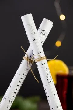 Musical notes against the background of a burning christmas drink Stock Photos