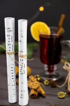 Musical notes against the background of a burning christmas drink Stock Photos
