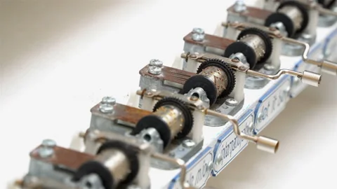 Musical notes are cranked in a row with different delicate music. Stock Footage 106632765