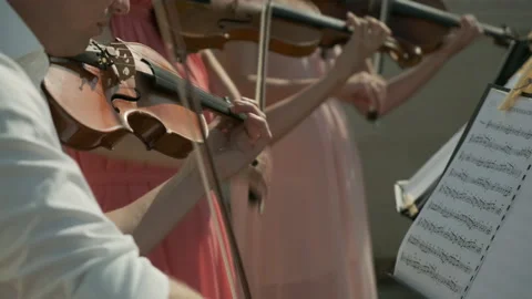Musical quartet playing violins close up. Wedding ceremony performance. Stock Footage 137123100