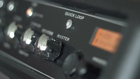 Musician Adding Master Volume on Guitar Amplifier Stock Footage 154659237