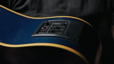 Musician Adjusting Equalizer Controls on Blue Acoustic Electric Guitar 库存影片 339366987