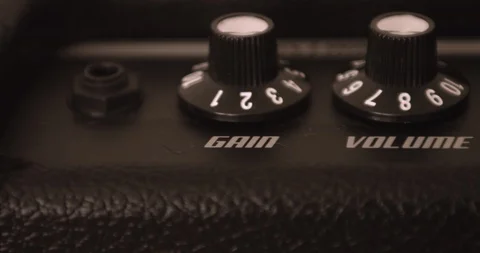 Musician Adjusting Knobs On Guitar Solid State Amp. Dolly Shot. Video stock 114643312