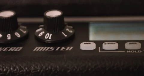Musician Adjusting Knobs On Guitar Solid State Amp. Dolly Shot. 스톡 동영상 114643870