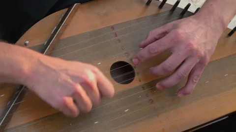 Musician hands beat the strings rhythmically. Man holds gusli. Close-up. Stock Footage 169051722