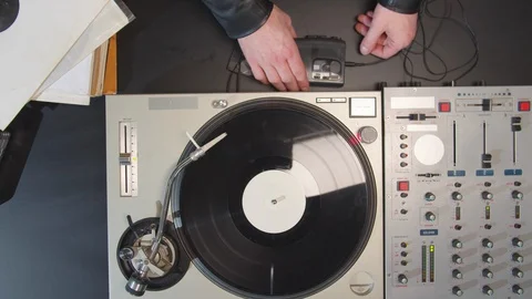 The musician inserts a cassette into the player Stock Footage 129974572
