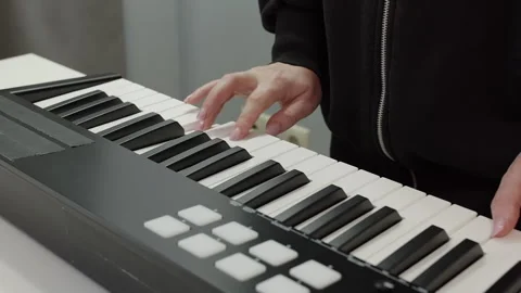 Musician playing electronic keyboard, creating music in studio Stock Footage 293268809
