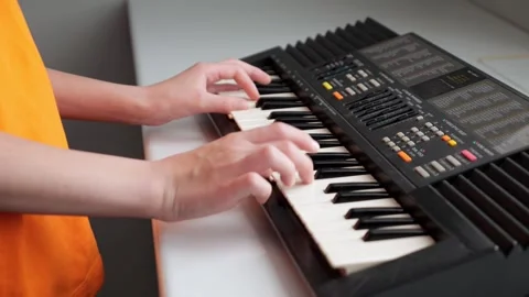 Musician playing electronic keyboard in sequence Video stock 308438236