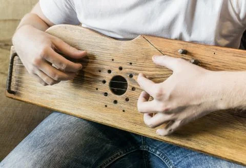 Musician playing gusli. closeup photo Stock Photos