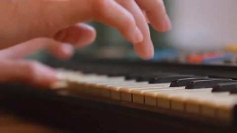 Musician playing keyboard in home studio Video stock 299858013