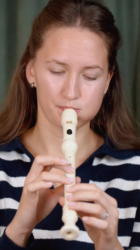 Musician playing recorder flute in split screen montage 库存影片 299751912