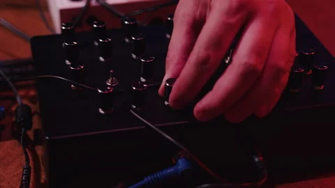 Musician playing synthesizer using multiple knobs Video stock 287341592