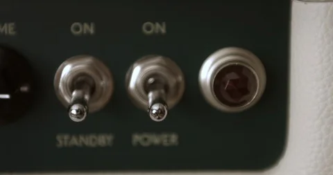 Musician Powering On And Adjusting Knobs On Tube Amp. Dolly Shot. 스톡 동영상 114640243