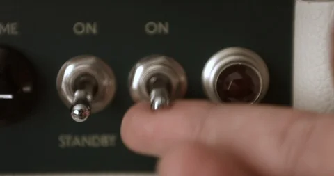 Musician Powering On And Adjusting Knobs On Tube Amp. Dolly Shot. Video stock 114640640