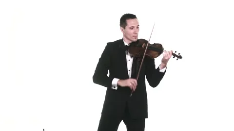 Musician in tuxedo performs a fast composition on a classical violin. Isolated Stock Footage 134495444