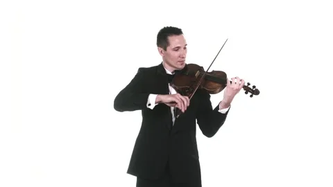 Musician in tuxedo performs a slow composition on a classical violin. Isolated Stock Footage 134495423