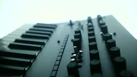 Musician tweaking knobs on analog synthesizer 스톡 동영상 311941300