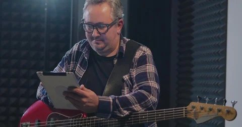 Musician using tablet during break Video stock 97986795