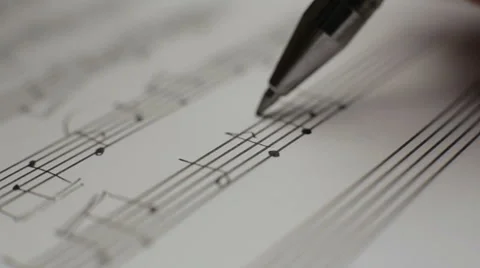 Musician writes notes in the music book Stock Footage