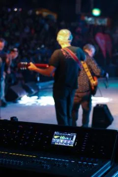 Musicians and console. Stock Photos