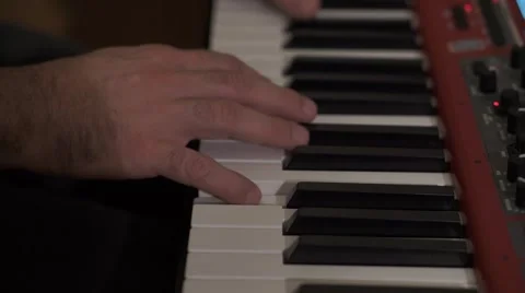 Musician's hands moving  on a red keyboard Vidéo 44444673