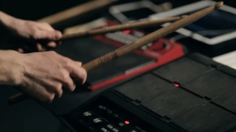 Musician's hands play on electronic pads with drumsticks Video stock 90998638