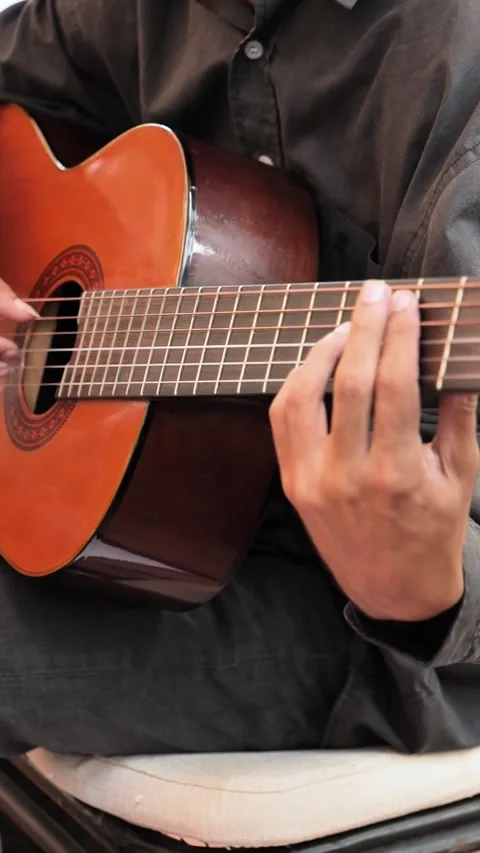 Musician's hands playing guitar live Stock Footage 307305023