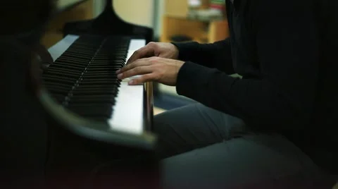 Musician's Hands Playing Piano in a Studio Stock Footage 49752234