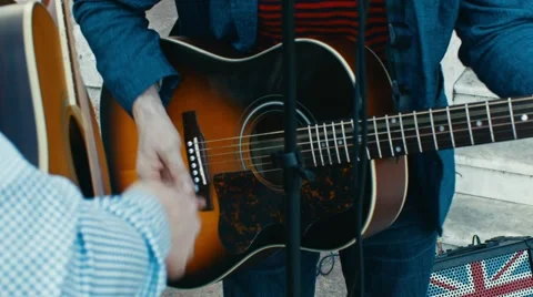 Musicians perform on the street Stock Footage 63944049