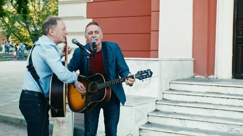 Musicians perform on the street Stock Footage 63948673